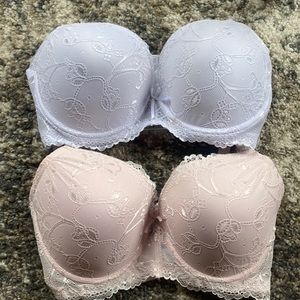 Two brand new with tags , Lacey sexy Bras ! 1 little pink and the other white !